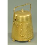 An Art Nouveau brass coal receiver, lidded with loop handle and embossed with stylised designs,