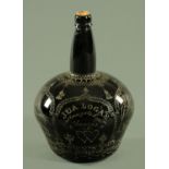 A 19th century glass club shaped bottle, etched to commemorate a marriage, J & A Logan,