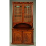 A late Victorian mahogany cupboard, in two sections,