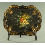 A Victorian papier mache tray, handpainted with floral sprays and with stand. Width 80 cm.