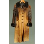 A ladies pony skin 3/4 length jacket, with faux fur collar and cuffs.