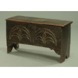 An oak six plank coffer, late 17th century, the split pin hinged top with moulded edge,