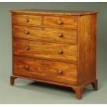 An early 19th century mahogany chest of drawers,