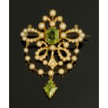 A seed pearl and peridot set brooch, in gold coloured metal mount. 35 mm x 45 mm.