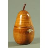 A turned fruitwood pear shaped tea caddy. Height 15.5 cm.