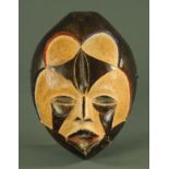 A West African carved wood mask, 20th century, Nigeria/Cameroon,