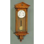 A 19th century walnut veneered Vienna style regulator wall clock,
