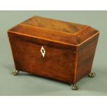 A George III mahogany tea caddy, with boxwood strung edge and two interior compartments,