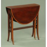 An Edwardian inlaid mahogany Sutherland table, with fretwork ends and raised on splayed feet.