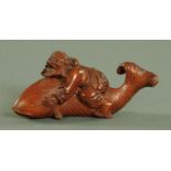 A Japanese carved wood figure of Ebisu riding a carp, Meiji period. Length 14 cm, height 6.5 cm.