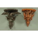 Two Black Forest carved wooden brackets, one depicting game the other an eagle, tallest 42 cm.