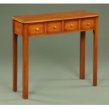 A burr oak side table, fitted with four frieze drawers and raised on moulded chamfered legs.