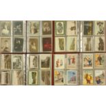 A collection of four postcard albums of 250+ cards, mostly Edwardian street scenes, comic cards,