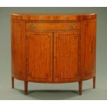 An Edwardian satinwood demi lune cabinet,