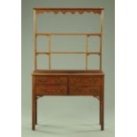 An early 20th century mahogany small dresser with Delft rack,