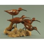 A carved wood group of two wading birds,