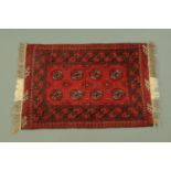 An Indian fringed rug,
