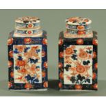 Two 19th century Japanese Imari caddies, each of square form with lid and interior cover,