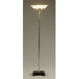 An Art Deco uplighter, with partially mirrored glass shade and chrome plated column,