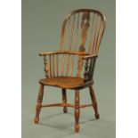 A 19th century Windsor armchair, with pierced splat back, solid seat,