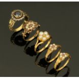 Five Victorian gold coloured metal rings, four set with seed pearls,