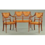 An Edwardian style bergere painted parlour suite, comprising settee and two armchairs,