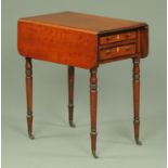 A late Georgian mahogany Pembroke table, with two drawers and two opposing dummy drawers,