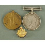 A 9 ct gold "The Border Regiment" badge,