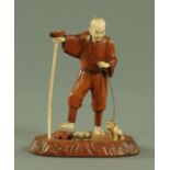 A Japanese carved wood and ivory Sarumawashi, Meiji period,