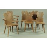 A set of two carver arm and four single oak dining chairs,