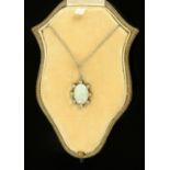A George V opal and diamond pendant on fine silver coloured chain, in original fitted box,