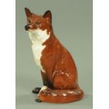 A Beswick fireside fox, model number 2348, in red/brown and white gloss finish. Height 31.5 cm.