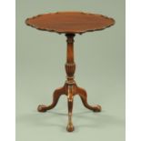 An Edwardian mahogany tripod table, with Chippendale border and snap action,