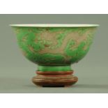 A Chinese green and aubergine dragon bowl, six character Kangxi mark within two blue circles,