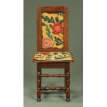 An antique oak child's chair, with woolwork tapestry back and matching cushion,