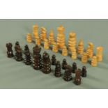 A vintage rosewood and boxwood chess set, tallest piece 88 mm.