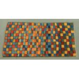 A Turkish square patterned rug in blues, red, browns and orange, 194 cm x 101 cm.