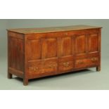 A large George III oak five panelled mule chest,