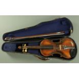 A German full size violin, 19th century, with carved lion head scroll with ivorine tuning pegs,