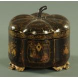 An early 19th century chinoiserie lacquered tea caddy, pumpkin shape,