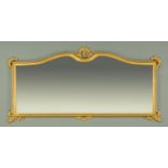 A gilt framed overmantle mirror, the top of serpentine outline, width 182 cm, height 92 cm.