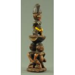 A West African carved wood fertility figure, 20th century, possibly Gabon,