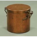 A Victorian copper pot and cover, of cylindrical form, each piece with two handles. Diameter 30.