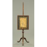 A 19th century mahogany pole screen,