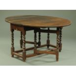 A oak drop leaf gate leg table, 17th century and later, having elliptical drop leaves,