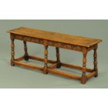 An oak stool, large rectangular form, with moulded edge,