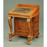A Victorian mahogany Davenport desk, with rear gallery and slope front to open interior,