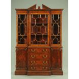 A small George III style mahogany bookcase,