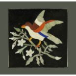 A Pietra Dura paperweight, of square form, decorated with a bird alighting a blossoming branch,