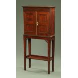 A late 19th century mahogany shallow cabinet on stand,